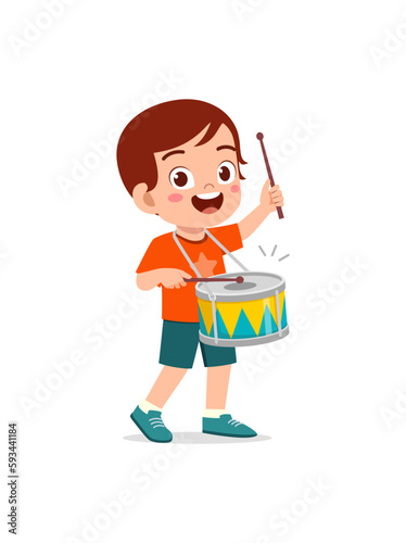 little kid playing one drum and feel happy