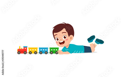 little kid playing toy train made from plastic and feel happy