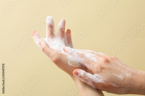 Hands with foam, spa, beauty procedures and skin care concept