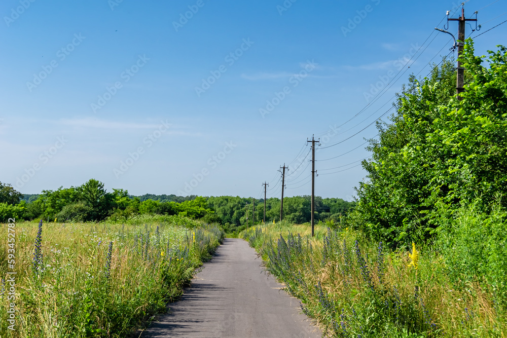 Beautiful empty asphalt road in countryside on colored background Beautiful empty asphalt road in countryside on colored background