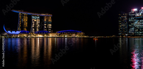 Singapore skyline illuminated at night on waterfront