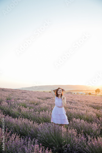 woman with bouquet in lavender nature walk journey at sunset