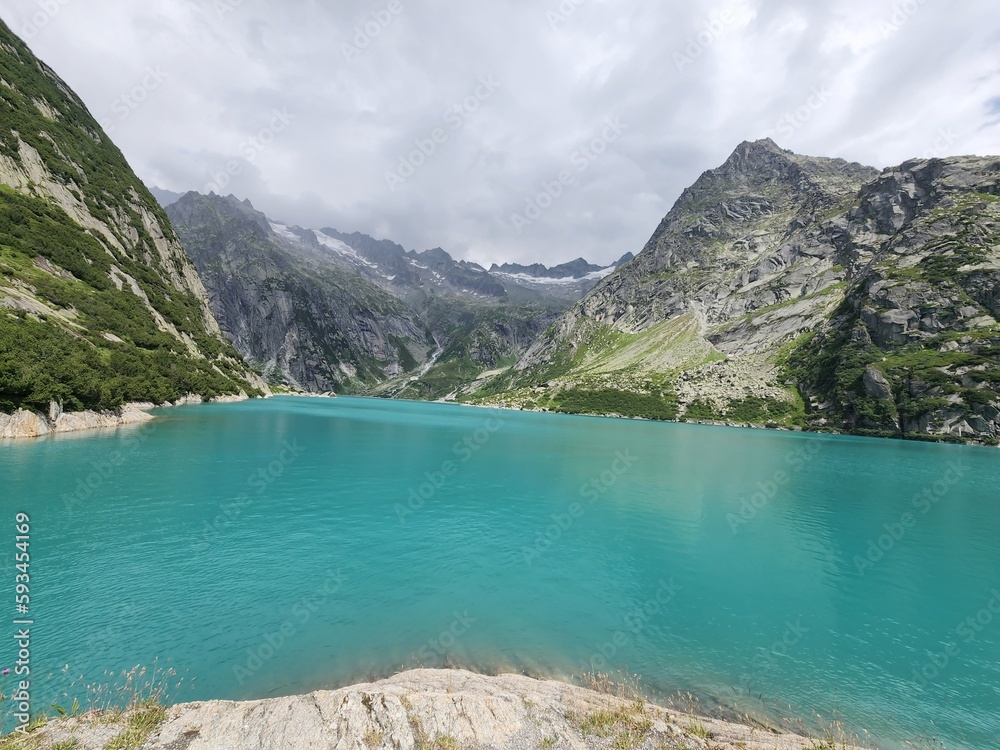 A mountain lake with blue water in Guttannen, Switzerland
