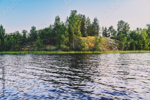 summer lake trip on boat, exploring and traveling in Europe. Beautiful sunset, water and trees. Active lifestyle concept