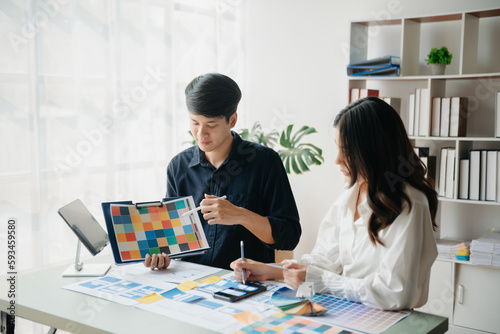 Asian businessman and woman people meeting in office. Employee brainstorm and work as team, plan and discuss project by point on paper and tablet. .