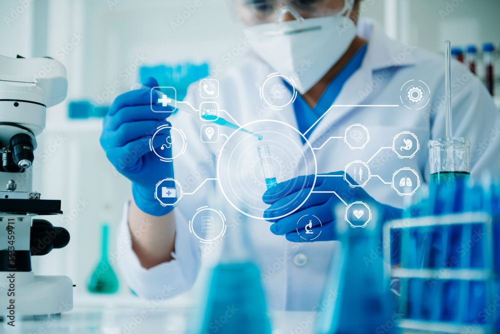 DNA molecule testing concepts. The doctor in a mask examines DNA molecules on the chemical laboratory with VR icon. DNA molecule testing concepts. The doctor in a mask examines DNA molecules on the chemical laboratory with VR icon.