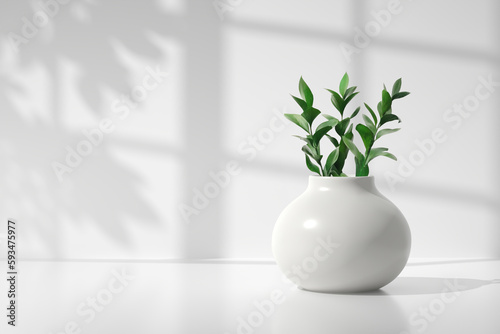 Kitchen counter with a modern decorative ceramic vase with green plants.