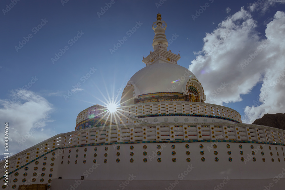 Shanti Stupa is a Buddhist monument located in Leh, India. It is a serene and majestic structure that offers panoramic views of the surrounding valley captured with sunburst. Shanti Stupa is a Buddhist monument located in Leh, India. It is a serene and majestic structure that offers panoramic views of the surrounding valley captured with sunburst.