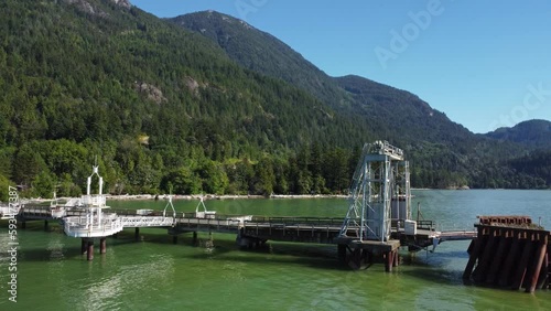 Wallpaper Mural Aerial view Porteaux Cove Squamish, BC. blue sky shimmering water create stunning scenery of vintage port station and heritage site surrounded by majestic mountains, rock formations and wild nature. Torontodigital.ca