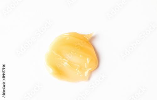 Top view of silky creamy texture of clean cleansing butter or balsam on white background. Cosmetic swatch