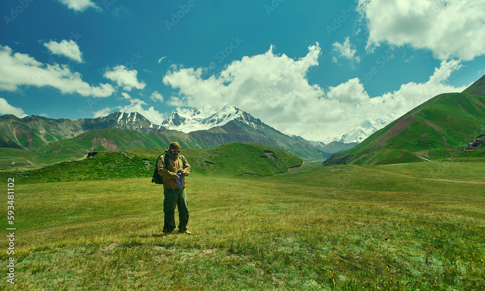 caucasian man with  backpacks View from p Pamir