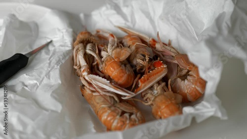 Fresh prawns and oysters from fish market in paper photo