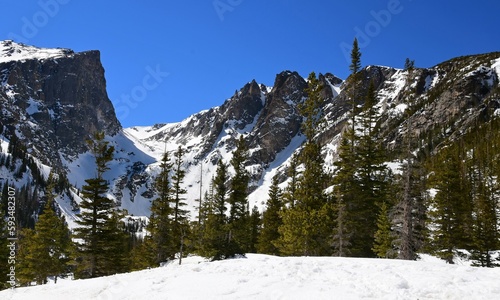 Hallett peak and flattop mountain on a sunny spring day  near dream lake along the emerald lake trail in rocky mountain national park, colorado  photo