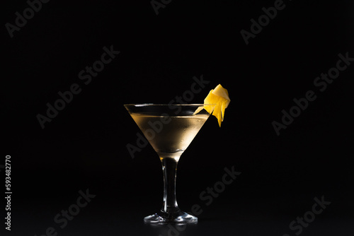 Lillet cocktail with sparkling wine and orange juice on a black background