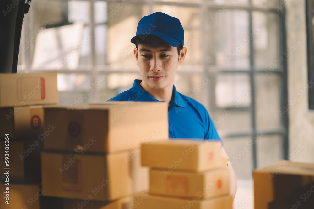 Asian delivery man work in truck for checking the product in the truck, concept ecommerce. Asian delivery man work in truck for checking the product in the truck, concept ecommerce.