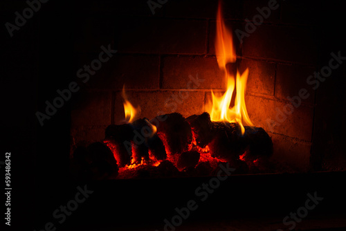 Closeup of burning firewood in the indoor fireplace