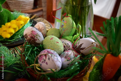 Easter eggs in the basket with decoration 