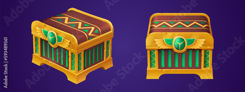 Closed Egyptian treasure chest set isolated on background. Vector cartoon illustration of ancient golden safe box decorated with wings sign, green gem stone, front angle view. Adventure game ui props