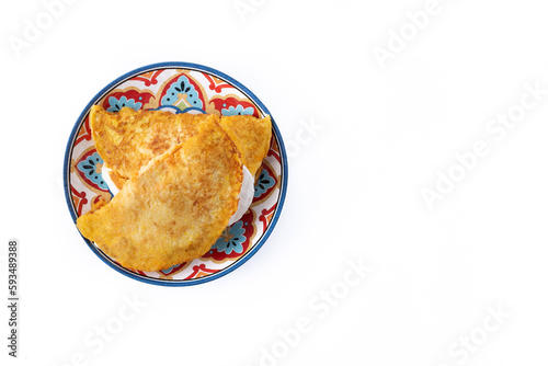 Traditional Venezuelan beef cachapa isolated on white background. Top view. Copy space photo