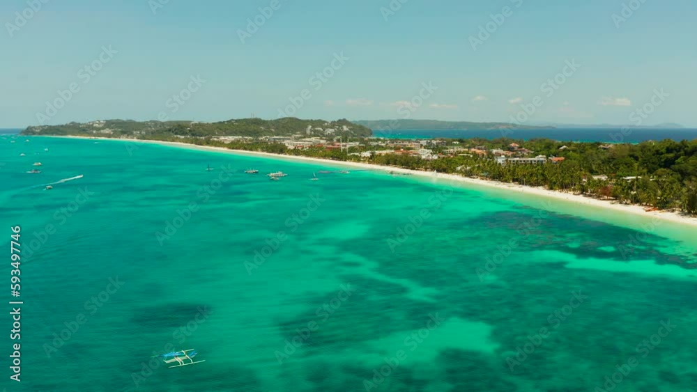Tropical beach with tourists and clear blue sea, top view. Summer and travel vacation concept. Boracay, Philippines Tropical beach with tourists and clear blue sea, top view. Summer and travel vacation concept. Boracay, Philippines