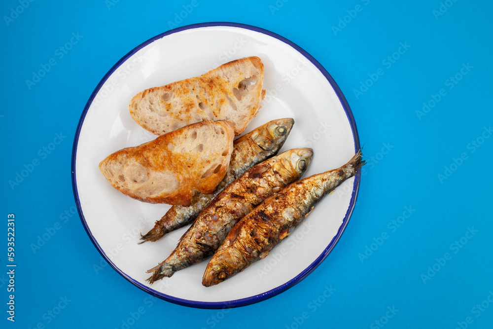 Grilled sardines with sauce on fresh bread Grilled sardines with sauce on fresh bread