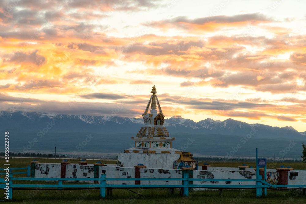 Buddhist stupa against the backdrop of mountains on sunrise. Buryatia, Russia