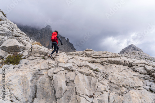 hiker on the crest of Puig de Ses Vinyes, 1105 meters, sierra de tramuntana, Escorca, Majorca, Balearic Islands, Spain