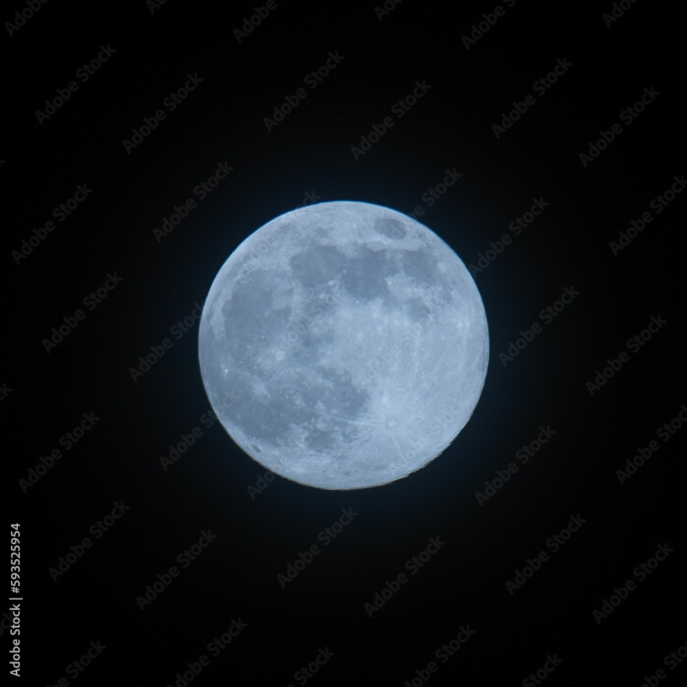 Beautiful view of a full moon in the dark sky at night in Norway Beautiful view of a full moon in the dark sky at night in Norway