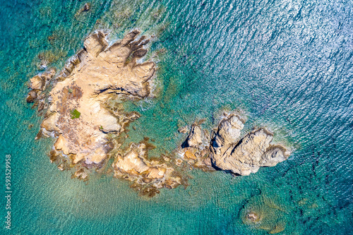 Palm Vai Beach, Crete, Greece - beautiful drone aerial view of rocky beach, blue water, sky
