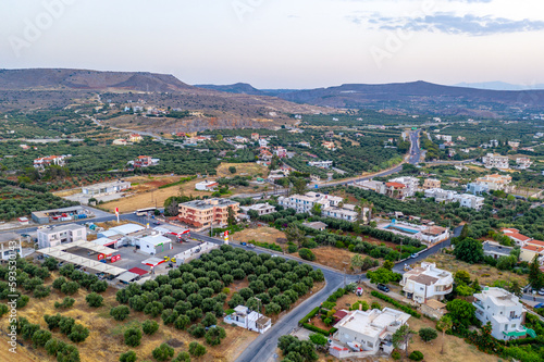 Fototapeta Naklejka Na Ścianę i Meble -  Crete, Greece - olive groves and city aerial view, landscape aerial photography, hills and mountains in the background