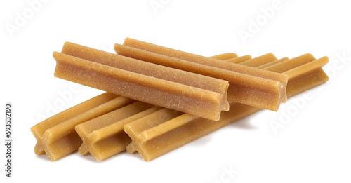Dog chews snacks sticks isolated on white background. Titbit for cleaning dogs teeth. Help for a dogs fresh breath. photo