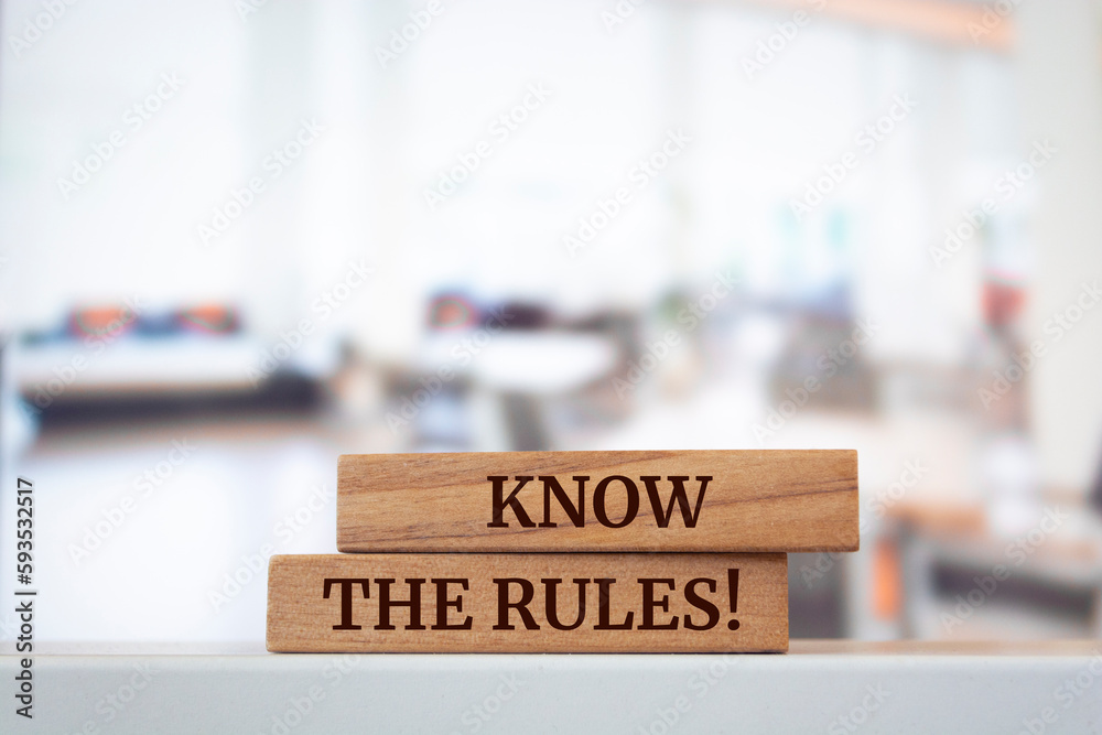 Wooden blocks with words 'KNOW THE RULES'. Wooden blocks with words 'KNOW THE RULES'.