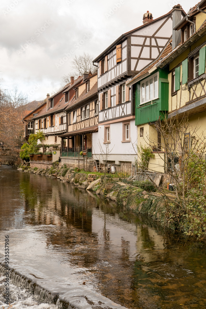 Kaysersberg; Alsace, France - December 7, 2022: Medieval houses by the river