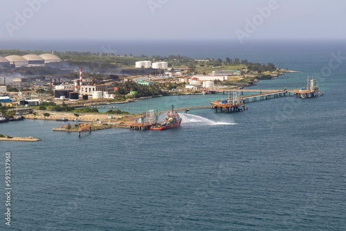 Tanker supporting with the supply of water for the extinction of the fire at the supertanker base