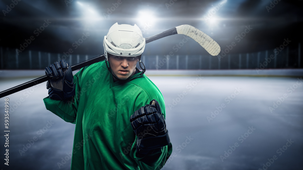 Naklejka premium Portrait of bold hockey player with hockey stick and uniform against rink.
