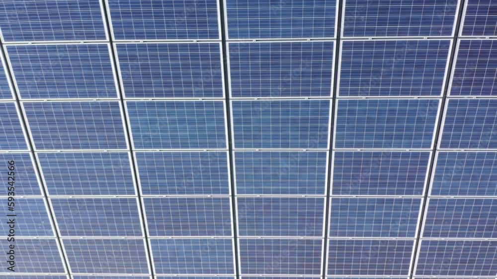Solar panel installation on roof of building. Aerial top down riser Solar panel installation on roof of building. Aerial top down riser