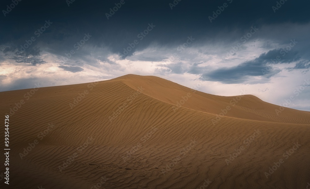 Beautiful shot of sand dune landscape with dark clouds in the desert