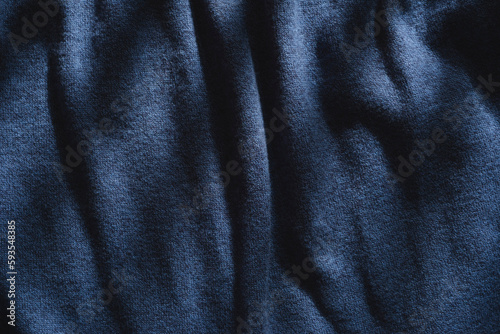 Abstract structure- wrinkles on the fabric. Textile- simple dark background