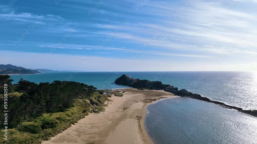 Aerial over sands joining Castlepoint's headland and reef forms Aotearoa Aerial over sands joining Castlepoint's headland and reef forms Aotearoa