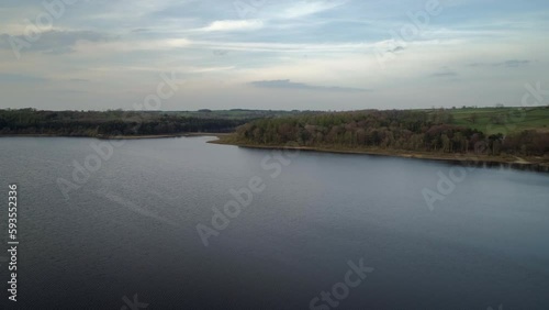 Establishing Aerial Drone Shot Flying Over Swinsty Reservoir in Yorkshire UK photo