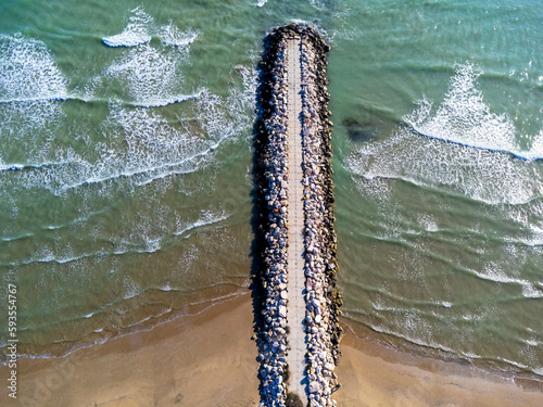 Obraz na płótnie Aerial view landscape Italy Pescara. Sea, waves, breakwater, stones, rocks, beach, sand, empty. w salonie