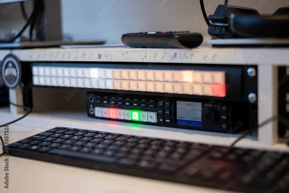 Selective focus shot of vision mixer with illuminated buttons