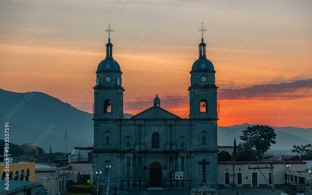 Drone shot of the Juan Bautista Catholic church at sunset in Tuxpan, Jalisco, Mexico