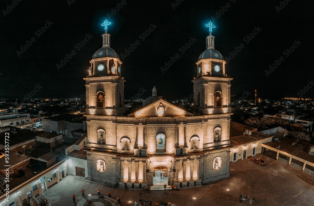 Drone shot of the Juan Bautista church at night in Tuxpan, Jalisco, Mexico