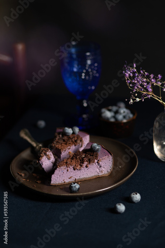 Blueberry cheesecake with chocolate chips. Low key  vertical frame