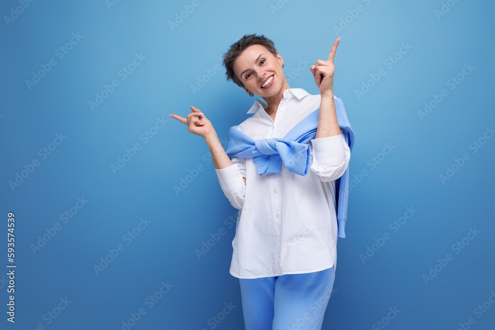 energetic fashionable dark-haired woman in a cool look with a genius proposal points her finger energetic fashionable dark-haired woman in a cool look with a genius proposal points her finger