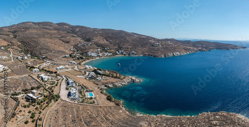 Fototapeta Naklejka Na Ścianę i Meble -  Tinos island, Cyclades Greece. Aerial drone view of Agios Romanos village, calm sea, blue sky.