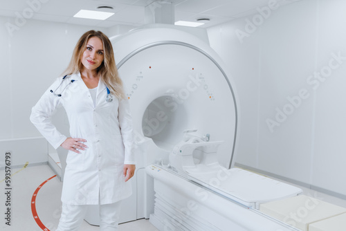 Portrait of a woman doctor in a white coat on the background of MRI. Clinic for diagnosis using a CT scanner.