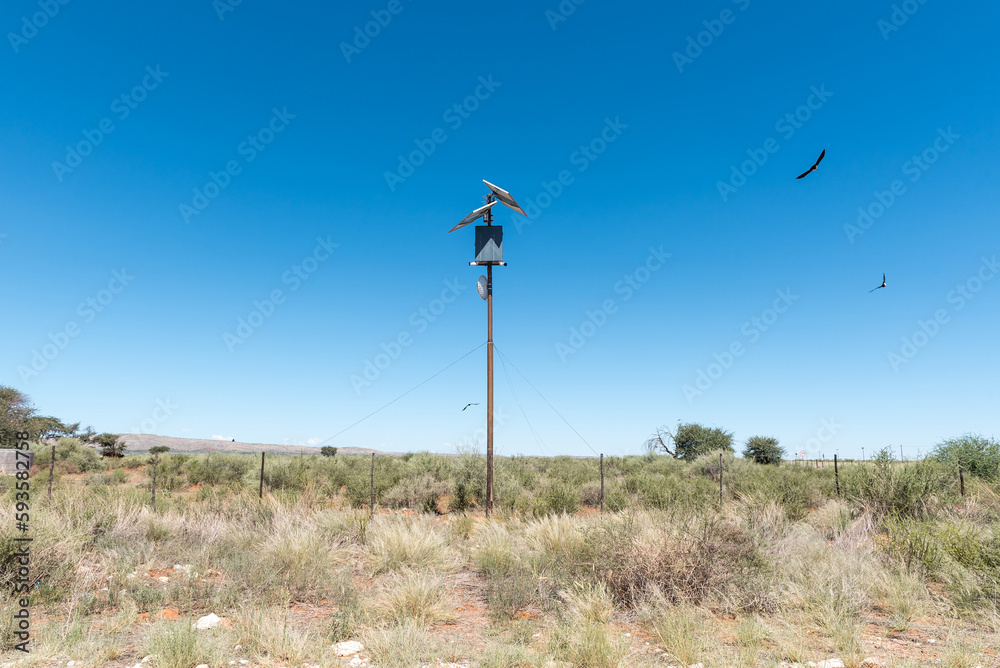 Fototapeta premium Security cameras, solar panels, comminications dish