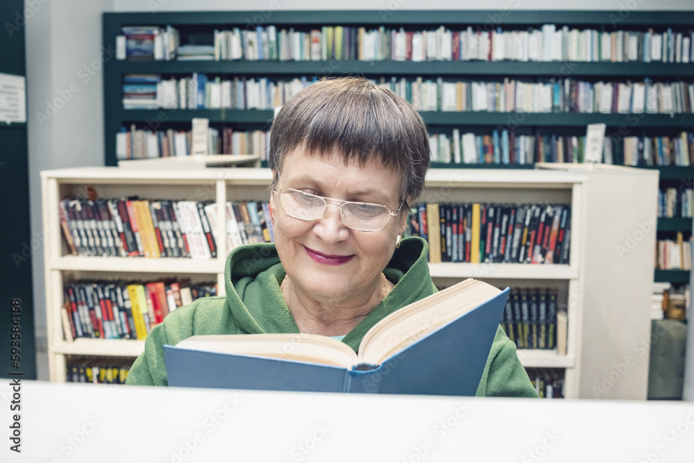 Grandmother with glasses in the city library. Grandmother with glasses in the city library.